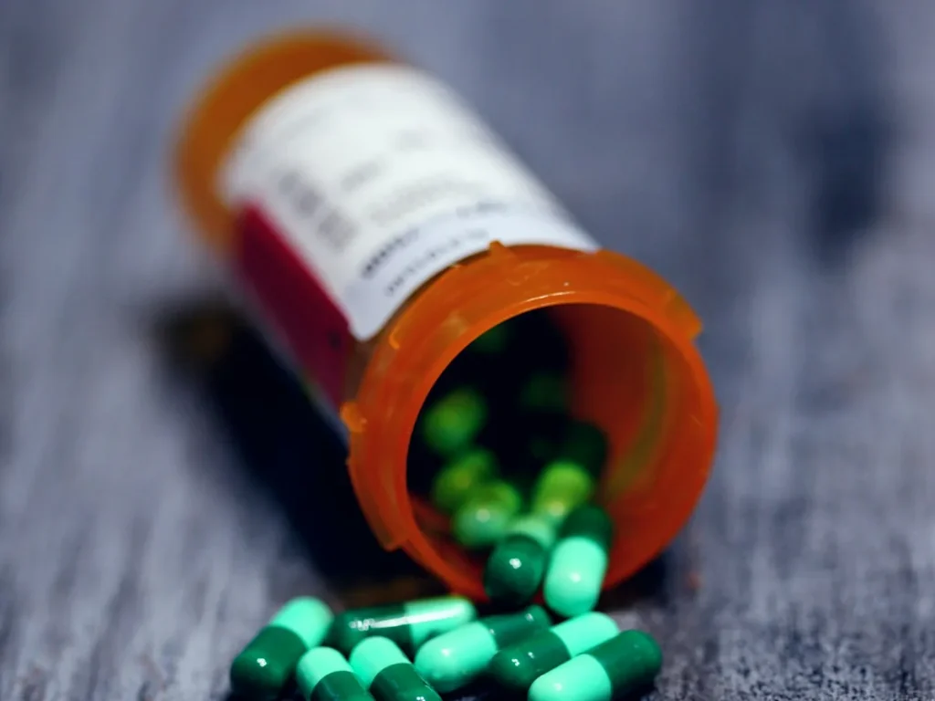 Prescription bottle with capsules spilling out, representing gabapentin withdrawal